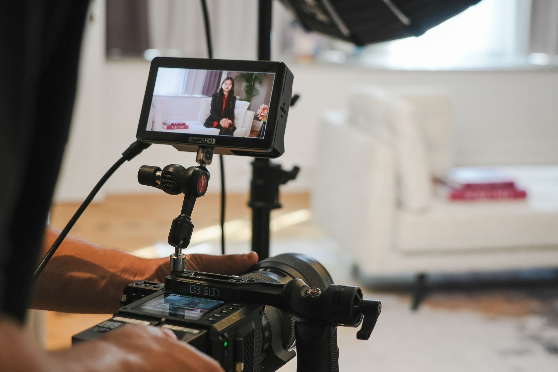 Cameraman holding camera for an interview